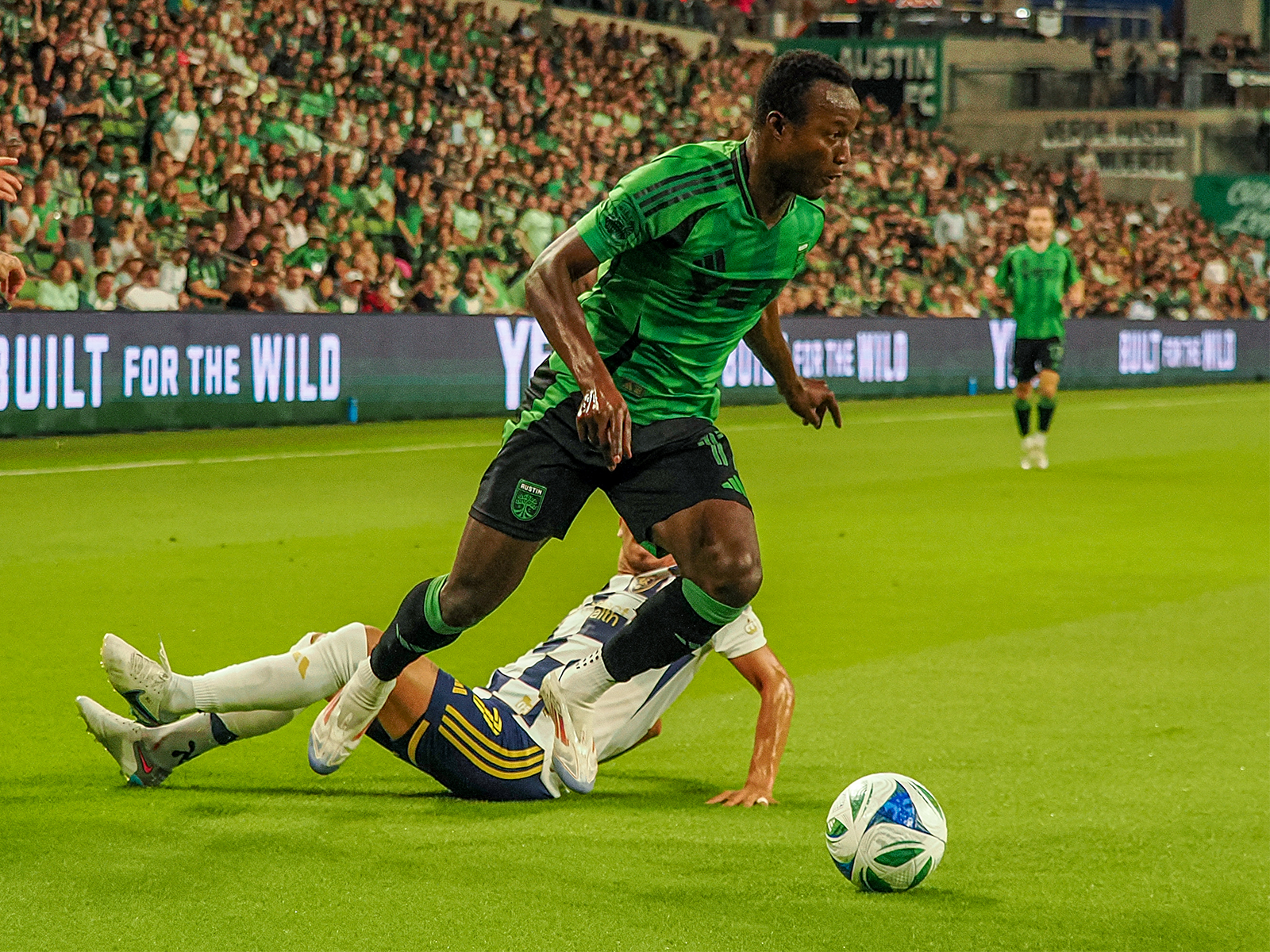 Osman Bukari getting around an RSL defender (third of three photos) 