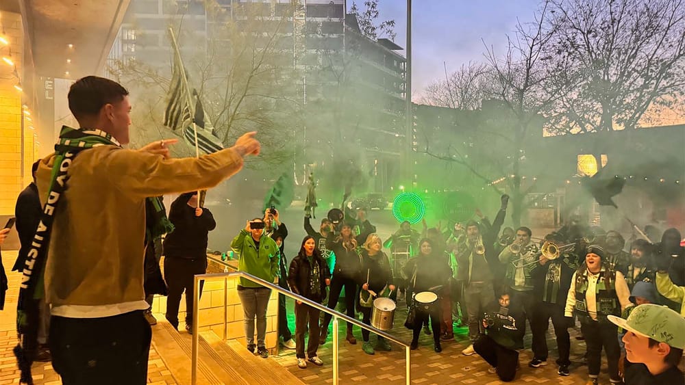 Brandon Vazquez meeting fans with horns and drums outside Fairmont Hotel in Austin