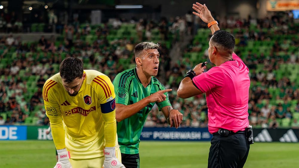 Myrto Uzuni of Austin FC angry with ref while St. Louis goalkeeper Roman Burki is hunched over