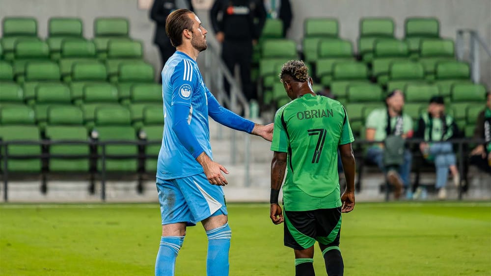 Jáder Obrian being comforted by Brad Stuver