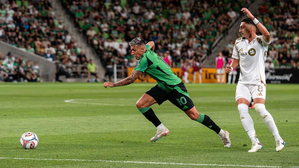 Austin FC's Myrto Uzuni runs toward ball while LAFC's Mark Delgado looks on