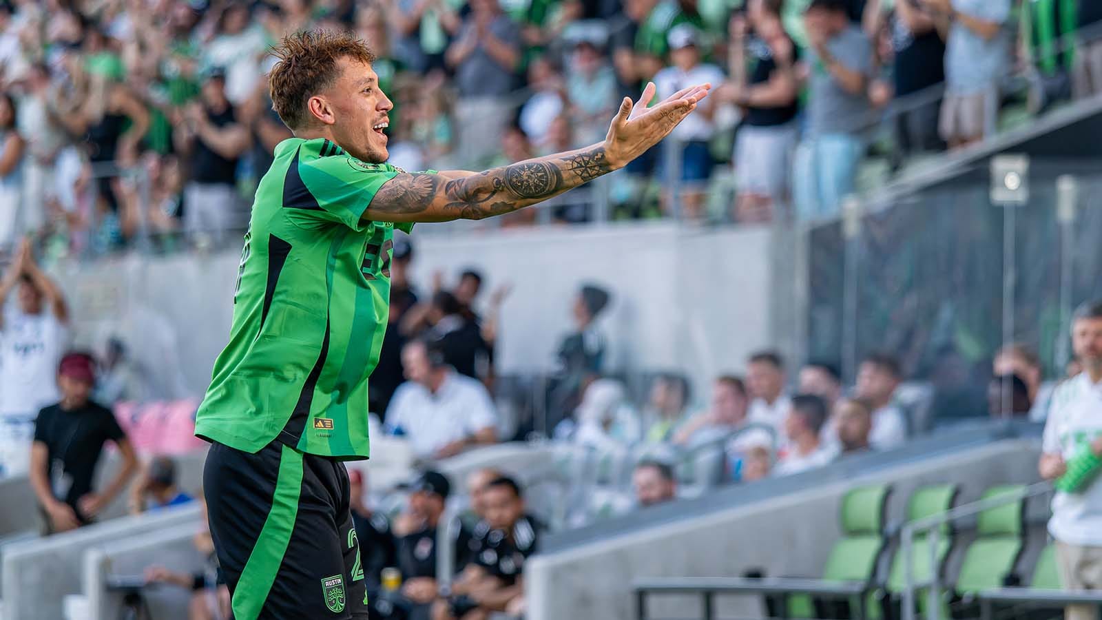Austin FC fullback Guilherme Biro celebrating in front of home fans