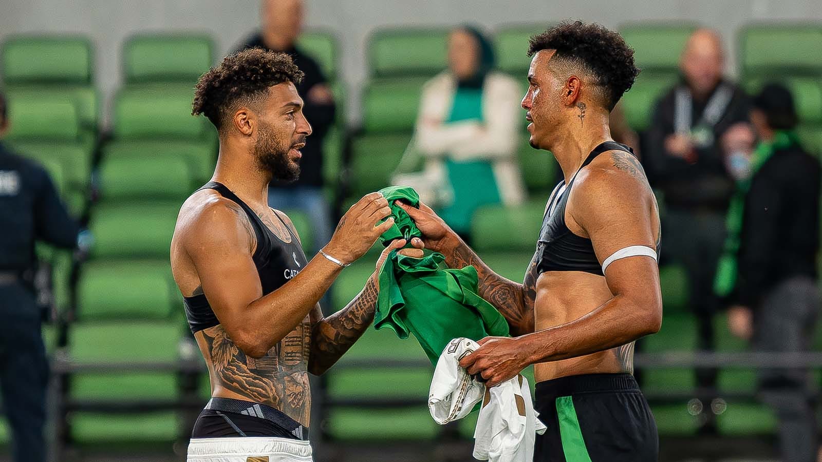 LAFC's Denis Bouanga and Austin FC's Julio Cascante trade jerseys after their playoff match