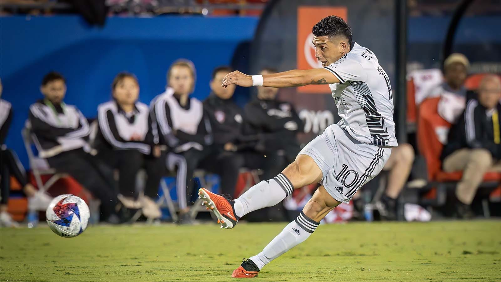 Cristian Espinoza of San Jose Earthquakes kicking a ball