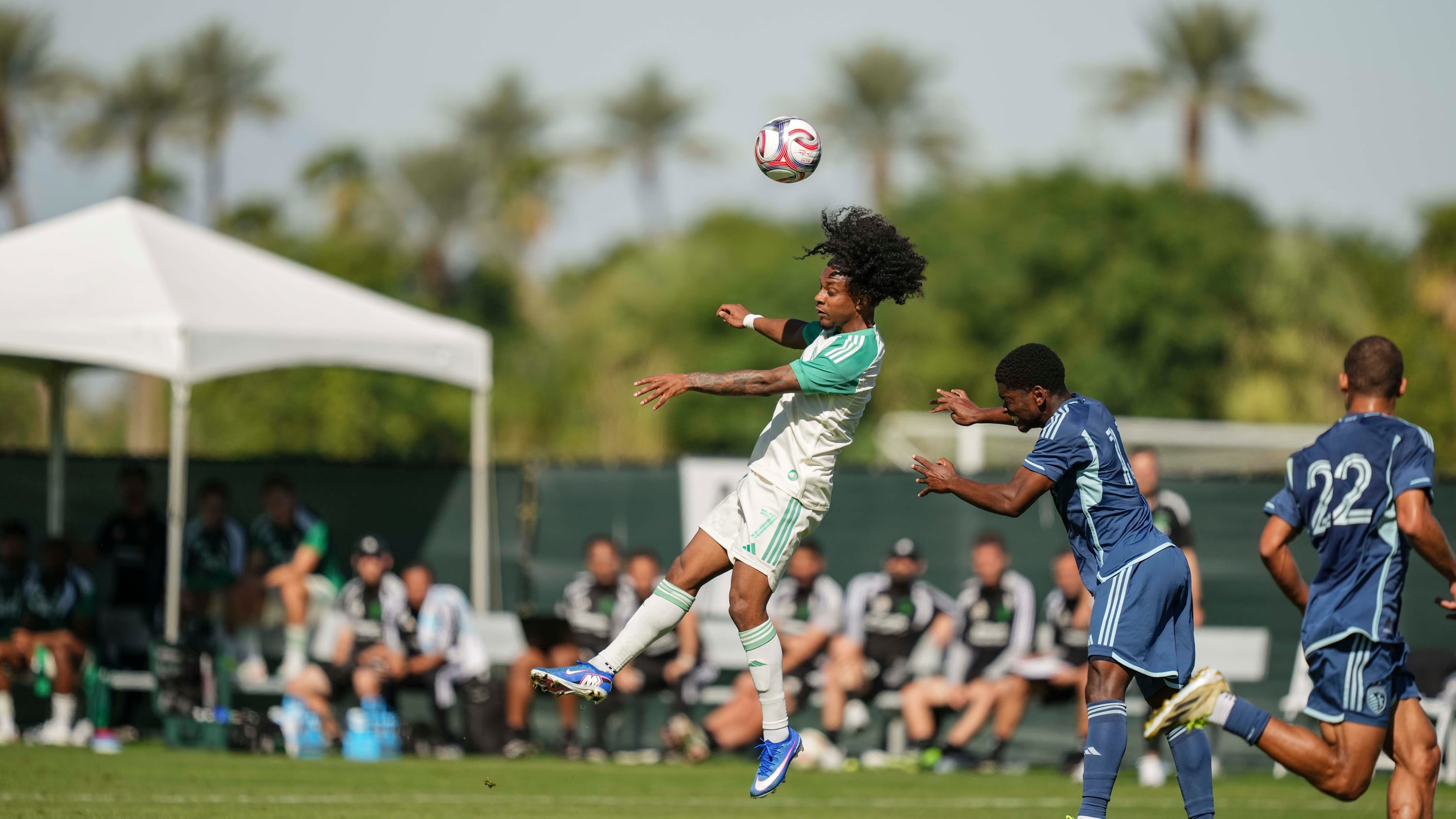 Jayden Nelson heading a ball in a Coachella preseason match against Sporting Kansas City