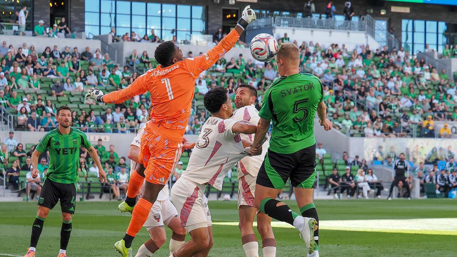 Sean Johnson reaching out for a ball headed by Oleksandr Svatok