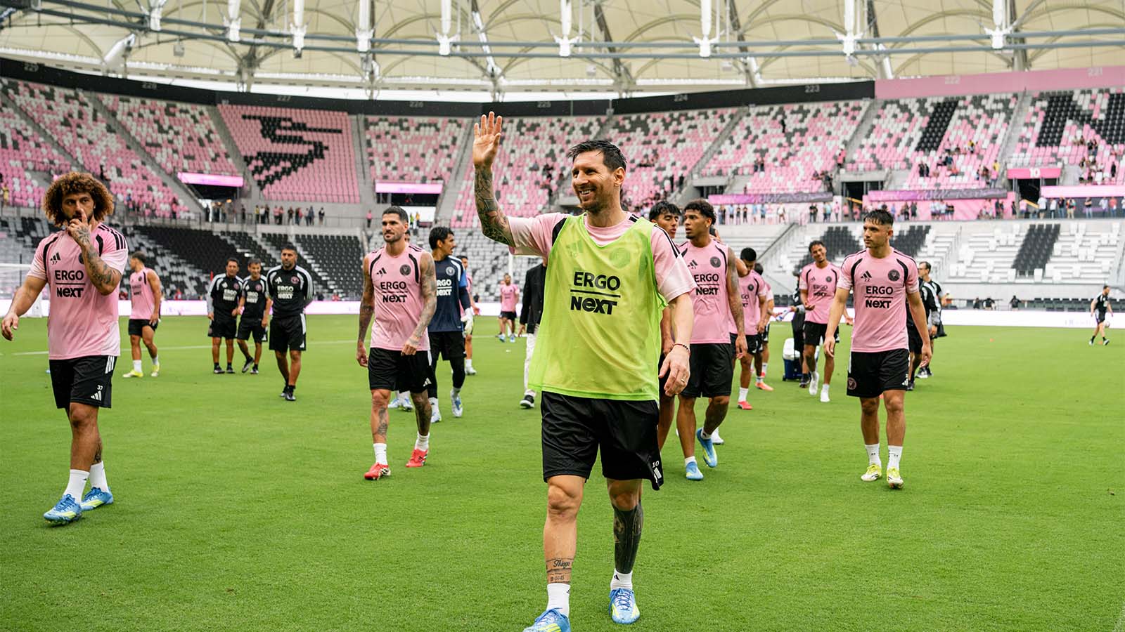 Lionel Messi and other Inter Miami players walking out onto their new home pitch for a practice